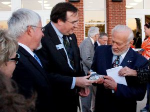 Marc Wheat presenting a reprentation of the Germanna Visitor Center to Buzz Aldrin